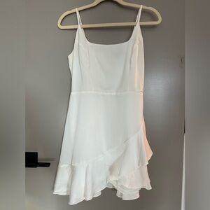 Lulu’s white satin ruffle mini dress.